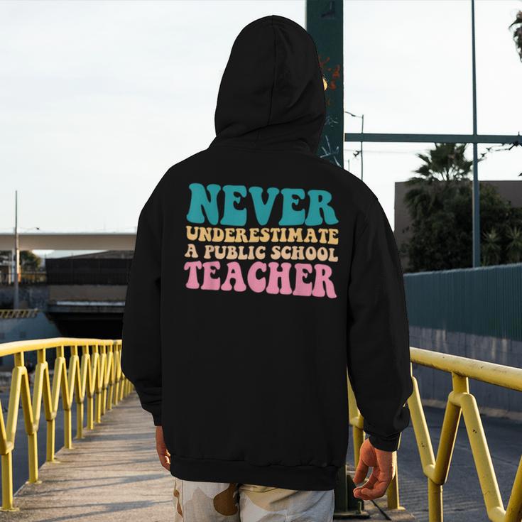 Never Underestimate A Public School Teacher Groovy Women Men's Hoodie Back Print, Groovy Teacher Gifts, funny design Never Underestimate A Public School Teacher Groovy Women Men's Hoodie Back Print, Groovy Teacher Gifts, funny design
