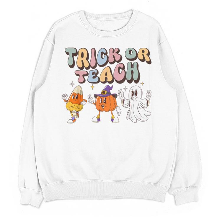 Trick Or Teach Candy Corn Pumpkin Ghost Teacher Unisex Sweatshirt, trending gift Trick Or Teach Candy Corn Pumpkin Ghost Teacher Unisex Sweatshirt, trending gift