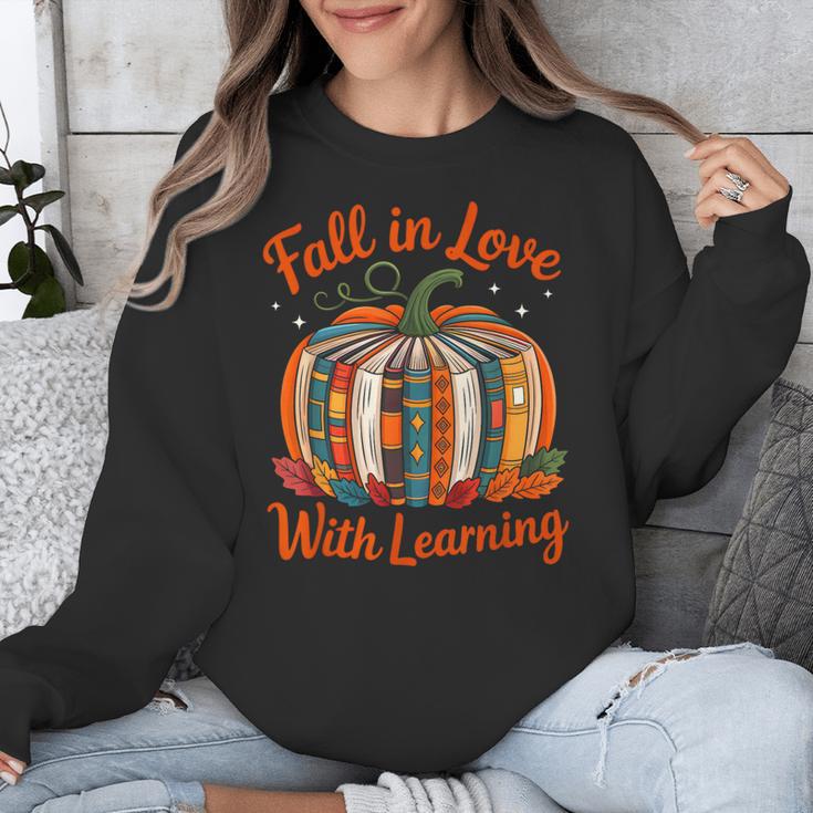 Fall In Love With Learning Book Lover Autumn Pumpkin Teacher Unisex Sweatshirt, funny design