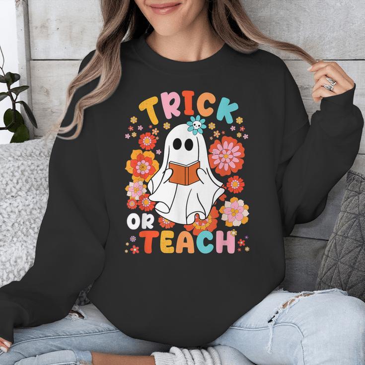 Groovy Halloween Trick Or Teach Retro Floral Ghost Teacher For Men Women Kids Unisex Sweatshirt, Groovy Teacher Gifts, funny design Groovy Halloween Trick Or Teach Retro Floral Ghost Teacher For Men Women Kids Unisex Sweatshirt, Groovy Teacher Gifts, funny design