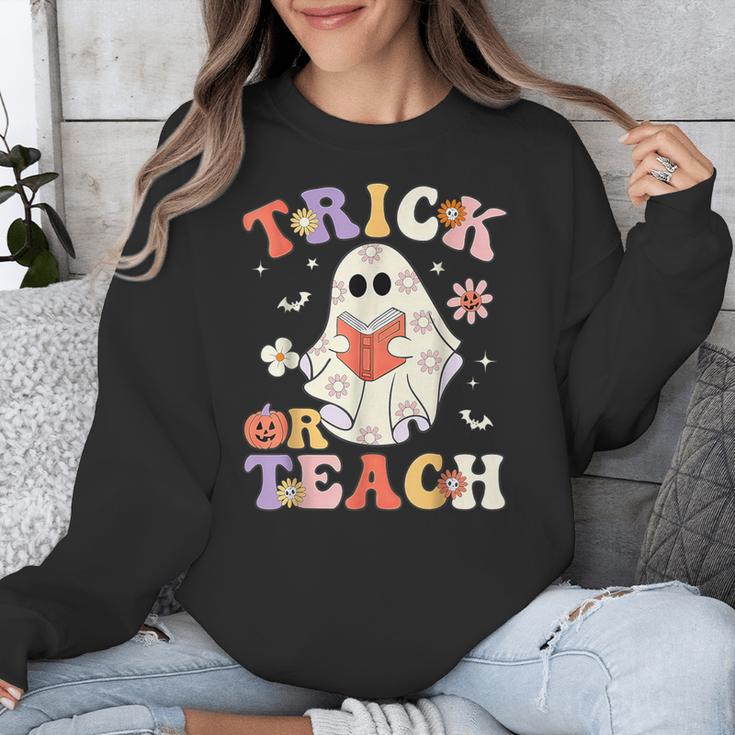 Groovy Halloween Trick Or Teach Retro Floral Ghost Teacher Unisex Sweatshirt, Groovy Teacher Gifts, funny design Groovy Halloween Trick Or Teach Retro Floral Ghost Teacher Unisex Sweatshirt, Groovy Teacher Gifts, funny design