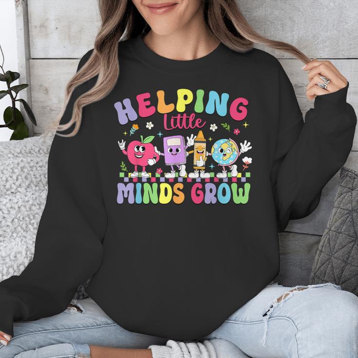 Helping Little Minds Grow Teacher Life Back To School Unisex Sweatshirt, funny design