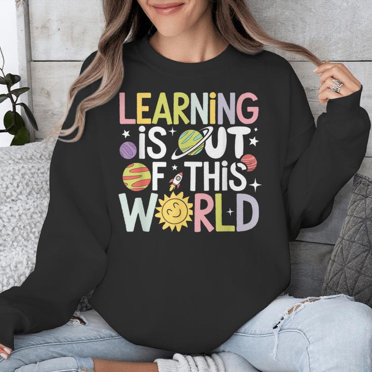 Learning Is Out Of This World Space Teacher Cute Groovy Unisex Sweatshirt, Groovy Teacher Gifts, funny design