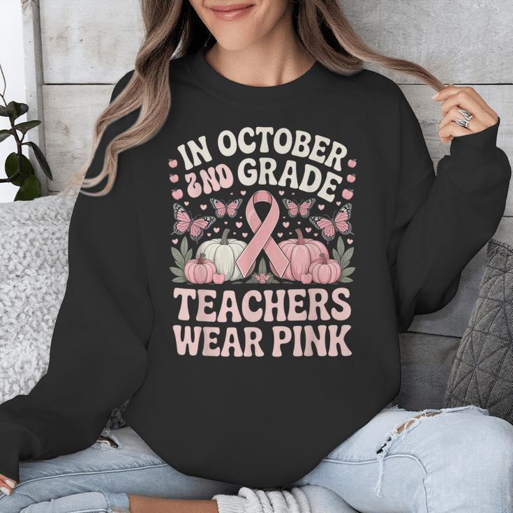 In October 2nd Grade Teachers Wear Pink Ribbon Breast Cancer Unisex Sweatshirt, funny design