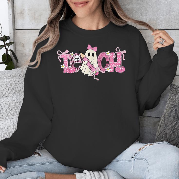 Pink Ghost Teach Halloween Teacher In Spooky Season Unisex Sweatshirt, funny design Pink Ghost Teach Halloween Teacher In Spooky Season Unisex Sweatshirt, funny design