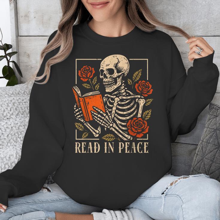 Read In Peace Skeleton Reading Book Halloween Teacher Unisex Sweatshirt, funny design Read In Peace Skeleton Reading Book Halloween Teacher Unisex Sweatshirt, funny design