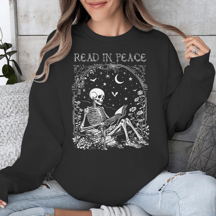 Read In Peace Skeleton Reading Teacher Spooky Halloween Unisex Sweatshirt, funny design Read In Peace Skeleton Reading Teacher Spooky Halloween Unisex Sweatshirt, funny design
