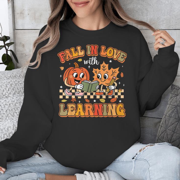 Retro Fall In Love With Learning Autumn Pumpkin Teachers Unisex Sweatshirt, funny design Retro Fall In Love With Learning Autumn Pumpkin Teachers Unisex Sweatshirt, funny design
