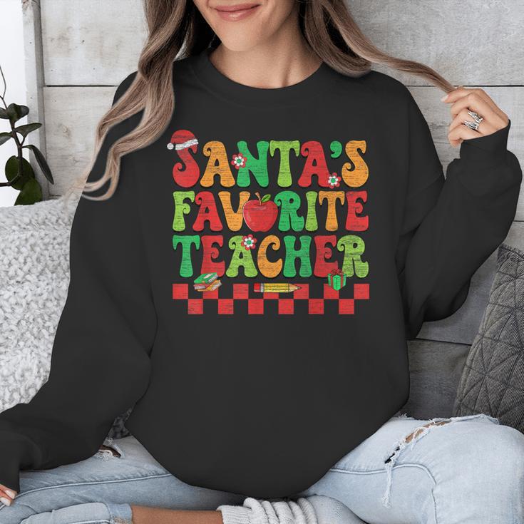 Santas Favorite Teacher Retro Groovy Christmas Xmas Women Unisex Sweatshirt, Groovy Teacher Gifts, funny design Santas Favorite Teacher Retro Groovy Christmas Xmas Women Unisex Sweatshirt, Groovy Teacher Gifts, funny design