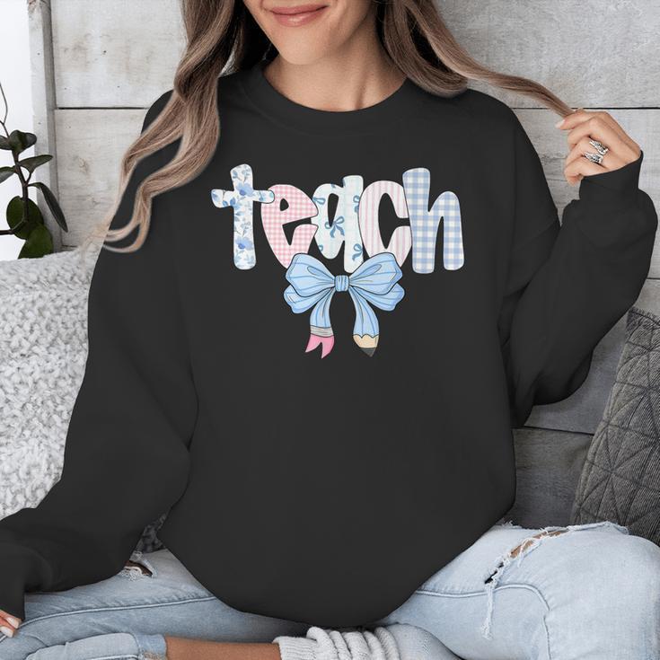 Teach Teacher Coquette Bow Pencil Back To School First Day Unisex Sweatshirt, funny design Teach Teacher Coquette Bow Pencil Back To School First Day Unisex Sweatshirt, funny design