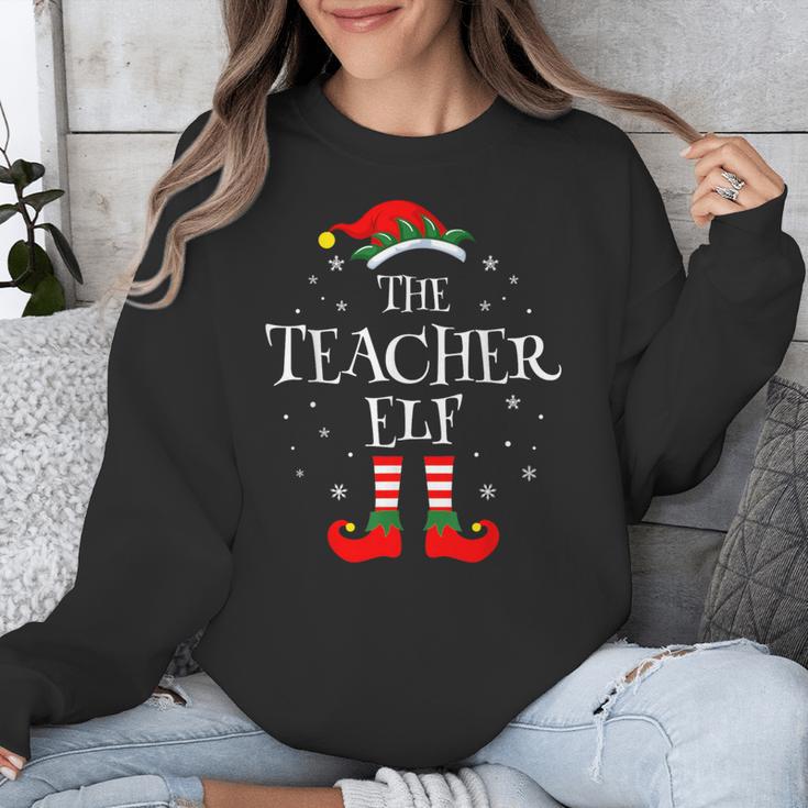 The Teacher Elf Christmas Family Matching Group Xmas Unisex Sweatshirt, funny design The Teacher Elf Christmas Family Matching Group Xmas Unisex Sweatshirt, funny design