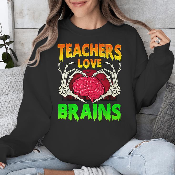 Teacher Teachers Love Brains Skeleton Hand Heart Halloween Unisex Sweatshirt, funny design Teacher Teachers Love Brains Skeleton Hand Heart Halloween Unisex Sweatshirt, funny design
