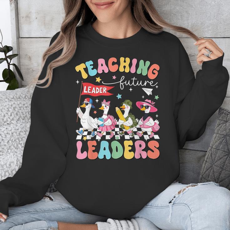 Teaching Future Leaders Groovy Teacher Back To School Unisex Sweatshirt, Future Teacher Gifts, Groovy Teacher Gifts, funny design