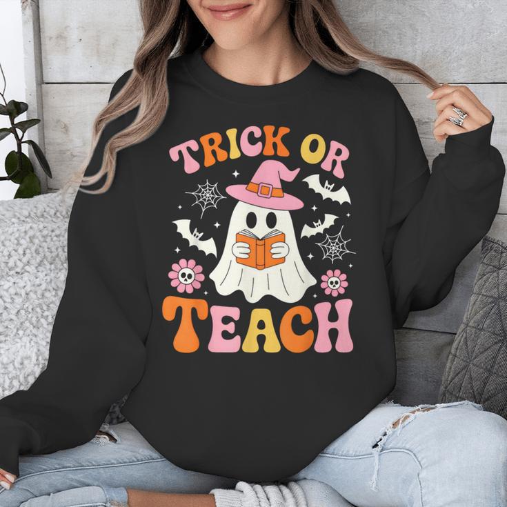 Trick Or Teach Cute Floral Ghost Teacher Halloween Costume Unisex Sweatshirt, funny design