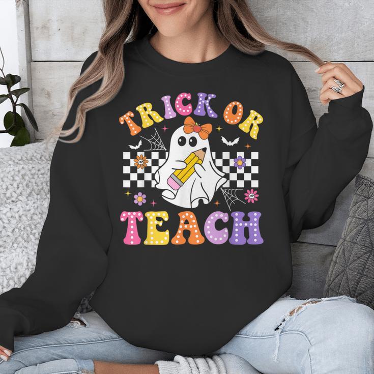 Trick Or Teach Groovy Halloween Teachers Unisex Sweatshirt, funny design Trick Or Teach Groovy Halloween Teachers Unisex Sweatshirt, funny design