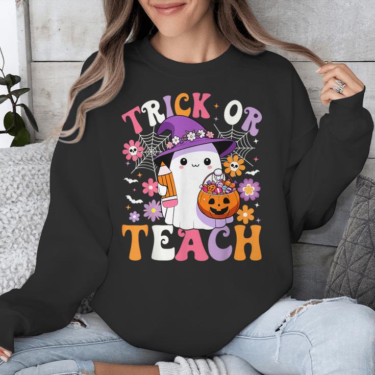 Trick Or Teach Groovy Teacher Ghost Halloween Teacher Unisex Sweatshirt, Groovy Teacher Gifts, funny design