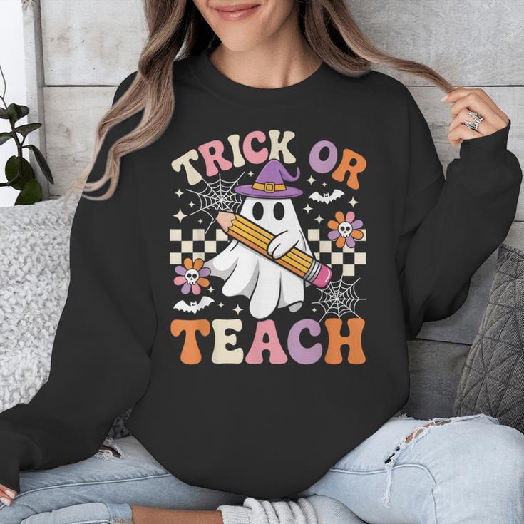 Trick Or Teach Groovy Teacher Halloween Retro Ghost Unisex Sweatshirt, Groovy Teacher Gifts, funny design Trick Or Teach Groovy Teacher Halloween Retro Ghost Unisex Sweatshirt, Groovy Teacher Gifts, funny design