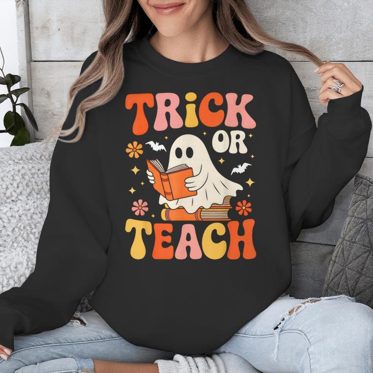 Trick Or Teach Halloween Shirt For Teacher Kids Floral Ghost Unisex Sweatshirt, funny design Trick Or Teach Halloween Shirt For Teacher Kids Floral Ghost Unisex Sweatshirt, funny design