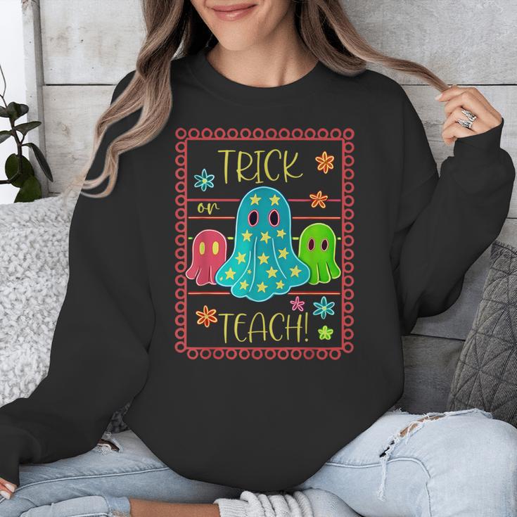 Trick Or Teach Neon Ghost Flower Teacher Spooky Halloween Unisex Sweatshirt, funny design Trick Or Teach Neon Ghost Flower Teacher Spooky Halloween Unisex Sweatshirt, funny design