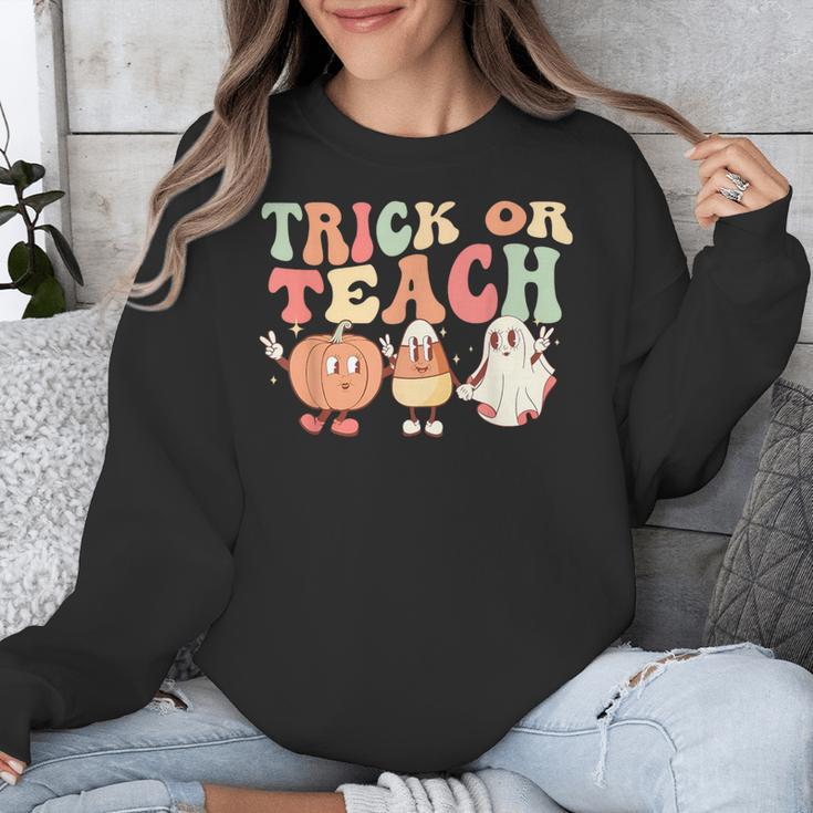 Trick Or Teach Pumpkin Candy Corn Ghost Halloween Teacher Unisex Sweatshirt, funny design