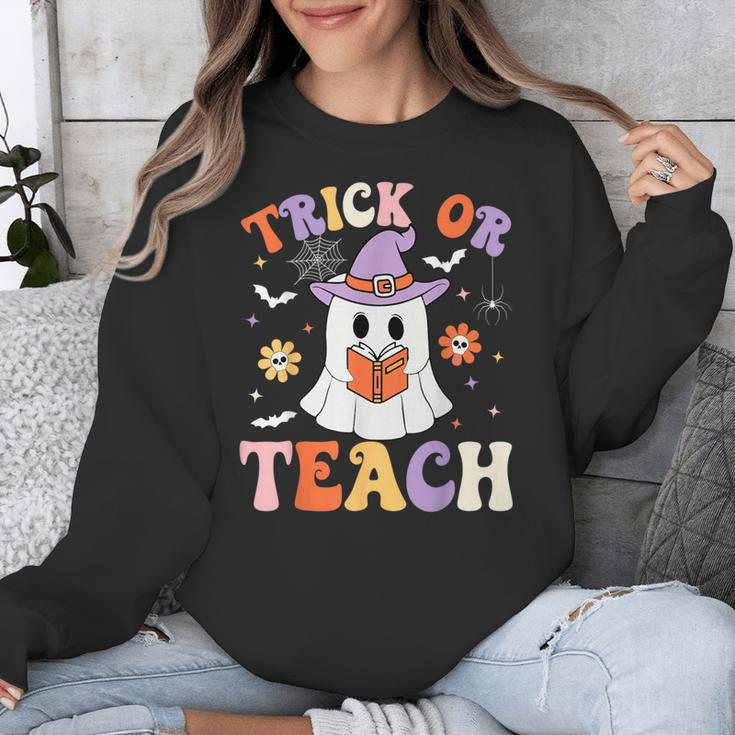 Trick Or Teach Teacher Groovy Ghost Halloween Teacher Unisex Sweatshirt, Groovy Teacher Gifts, funny design Trick Or Teach Teacher Groovy Ghost Halloween Teacher Unisex Sweatshirt, Groovy Teacher Gifts, funny design
