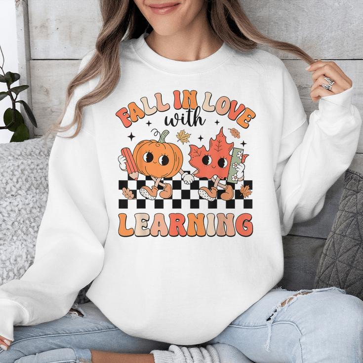 Retro Fall In Love With Learning Autumn Pumpkin Teacher Unisex Sweatshirt, funny design Retro Fall In Love With Learning Autumn Pumpkin Teacher Unisex Sweatshirt, funny design