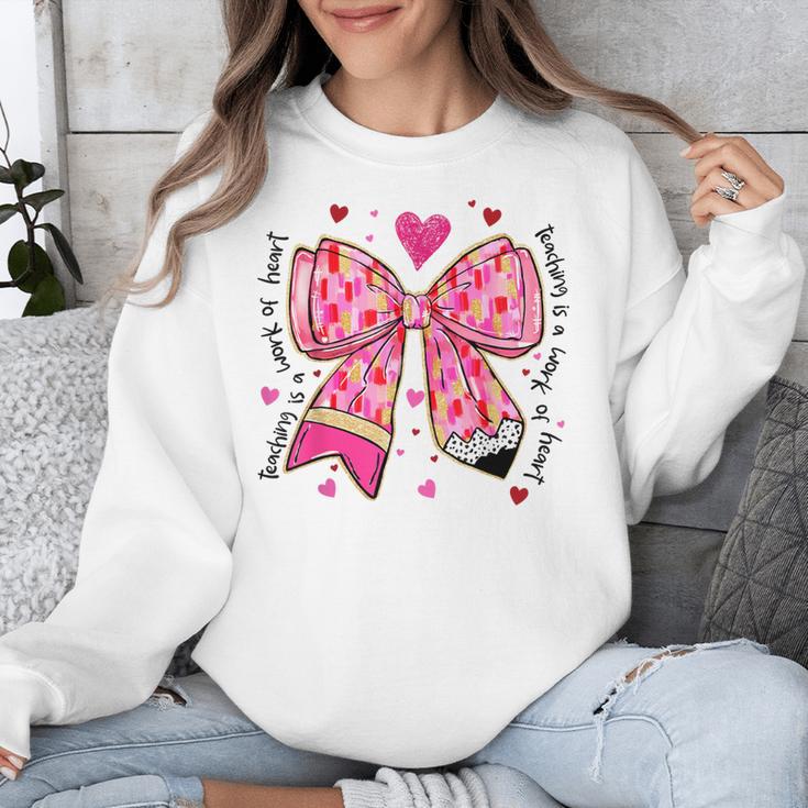 Teaching Is A Work Of Heart Pencil Bow Teacher Valentine Unisex Sweatshirt, funny design Teaching Is A Work Of Heart Pencil Bow Teacher Valentine Unisex Sweatshirt, funny design