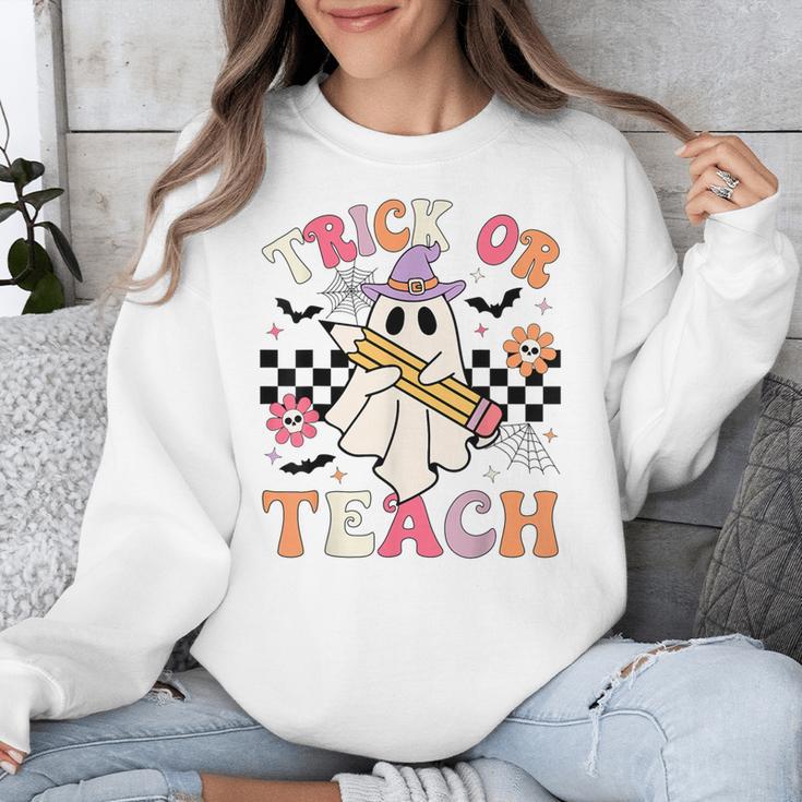 Trick Or Teach Groovy Teacher Halloween Retro Floral Ghost Unisex Sweatshirt, Groovy Teacher Gifts, funny design Trick Or Teach Groovy Teacher Halloween Retro Floral Ghost Unisex Sweatshirt, Groovy Teacher Gifts, funny design