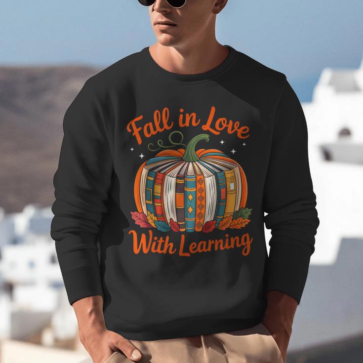 Fall In Love With Learning Book Lover Autumn Pumpkin Teacher Unisex Sweatshirt, funny gift