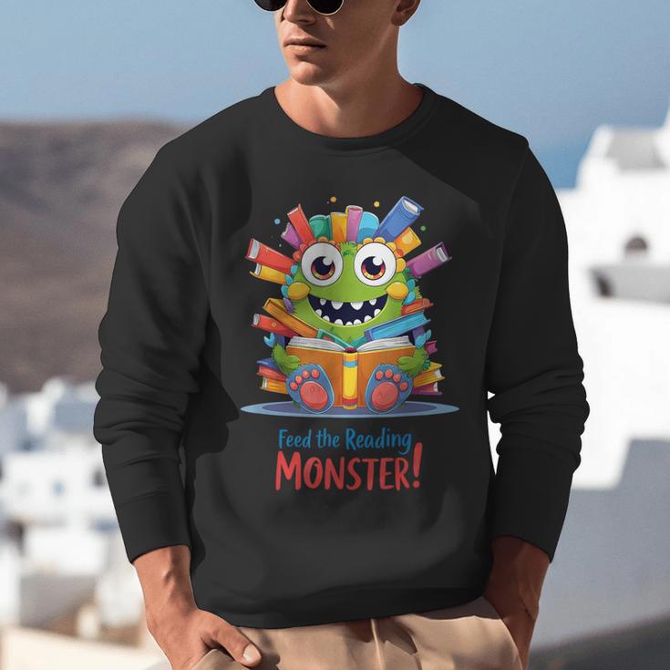 Feed The Reading Monster Halloween Teacher Unisex Sweatshirt, funny gift Feed The Reading Monster Halloween Teacher Unisex Sweatshirt, funny gift