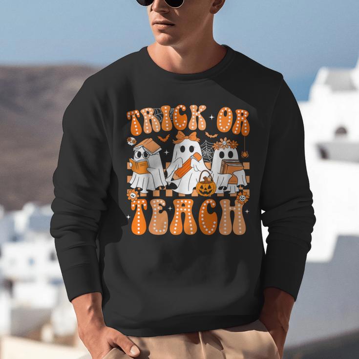 Groovy Teacher Halloween Trick Or Teach Ghost Men Women Kids Unisex Sweatshirt, Groovy Teacher Sweatshirts, funny gift Groovy Teacher Halloween Trick Or Teach Ghost Men Women Kids Unisex Sweatshirt, Groovy Teacher Sweatshirts, funny gift