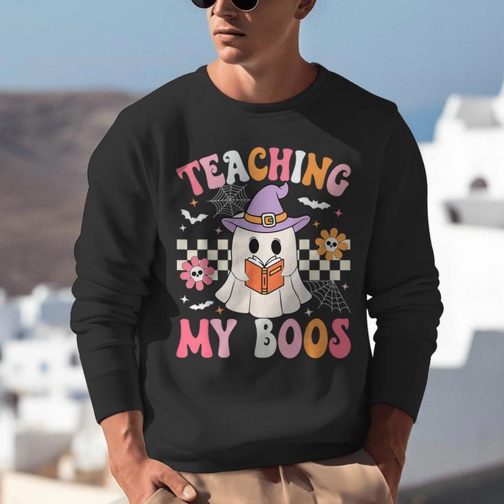 Groovy Teaching My Boos Teacher Ghost Halloween Teacher Unisex Sweatshirt, Groovy Teacher Sweatshirts, funny gift