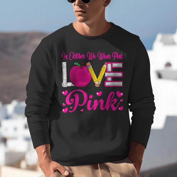 In October We Wear Pink Love Teacher Breast Cancer Awareness Unisex Sweatshirt, funny gift In October We Wear Pink Love Teacher Breast Cancer Awareness Unisex Sweatshirt, funny gift