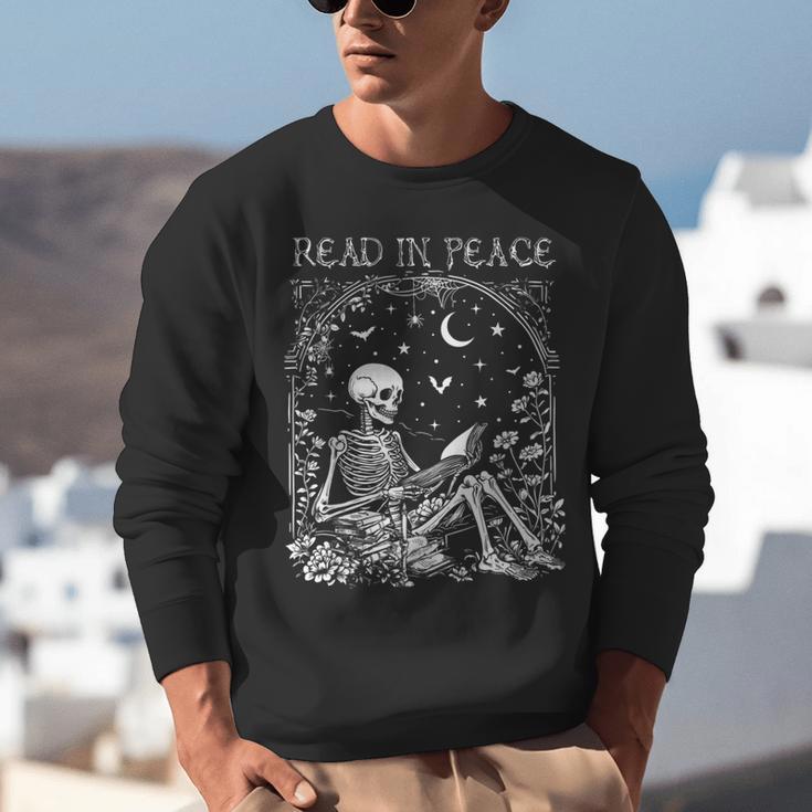 Read In Peace Skeleton Reading Teacher Spooky Halloween Unisex Sweatshirt, funny gift Read In Peace Skeleton Reading Teacher Spooky Halloween Unisex Sweatshirt, funny gift