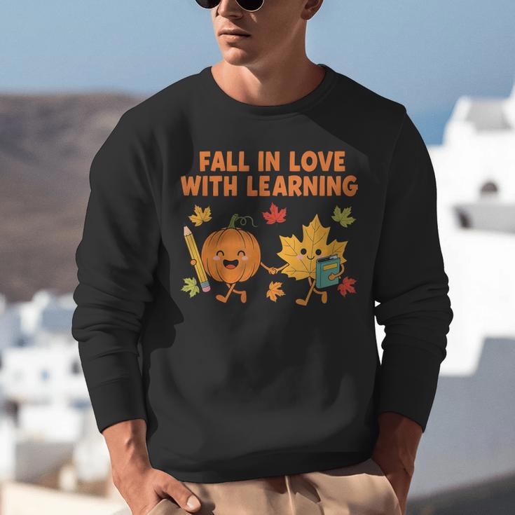 Retro Fall In Love With Learning Autumn Pumpkin Teacher Unisex Sweatshirt, funny gift Retro Fall In Love With Learning Autumn Pumpkin Teacher Unisex Sweatshirt, funny gift