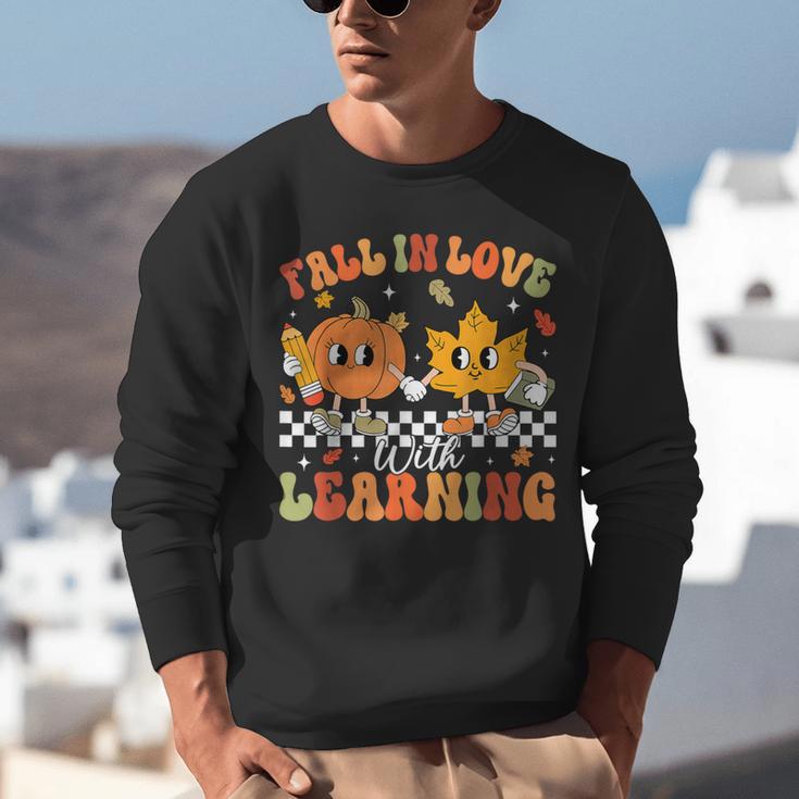 Retro Pumpkin Fall In Love With Learning Autumn Teacher Unisex Sweatshirt, funny gift Retro Pumpkin Fall In Love With Learning Autumn Teacher Unisex Sweatshirt, funny gift