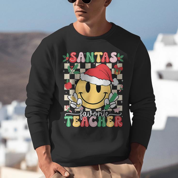 Santas Favorite Teacher Retro Groovy Smile Face Christmas Unisex Sweatshirt, Groovy Teacher Sweatshirts, funny gift Santas Favorite Teacher Retro Groovy Smile Face Christmas Unisex Sweatshirt, Groovy Teacher Sweatshirts, funny gift