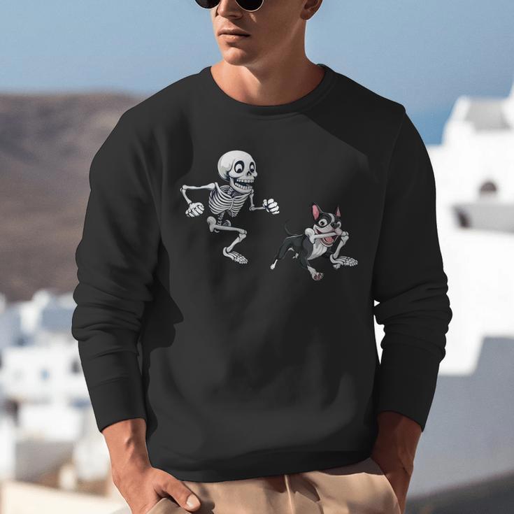 Skeleton Chasing Dog Boston Terrier Halloween Pet Lover Unisex Sweatshirt, Boston Terrier Halloween Sweatshirts, funny gift