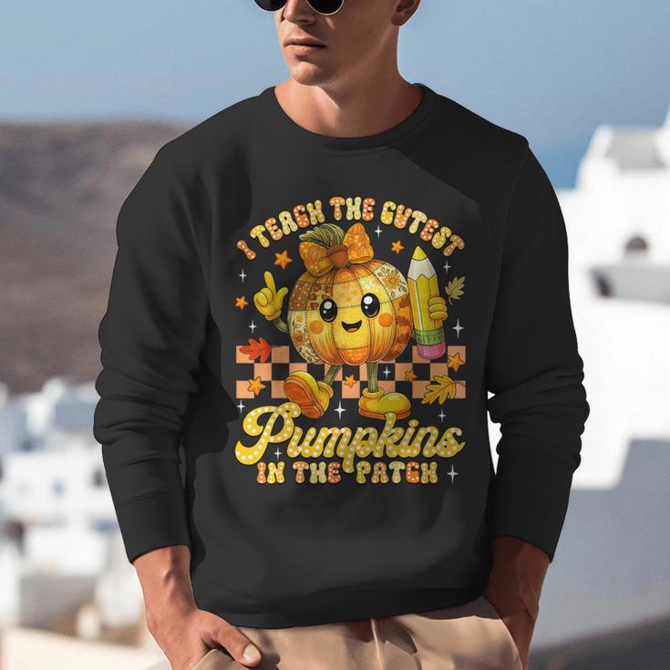 I Teach The Cutest Pumpkins In The Patch Teacher Halloween Unisex Sweatshirt, funny gift I Teach The Cutest Pumpkins In The Patch Teacher Halloween Unisex Sweatshirt, funny gift