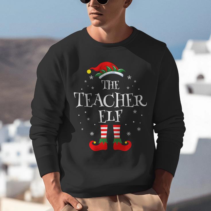 The Teacher Elf Christmas Family Matching Group Xmas Unisex Sweatshirt, funny gift The Teacher Elf Christmas Family Matching Group Xmas Unisex Sweatshirt, funny gift
