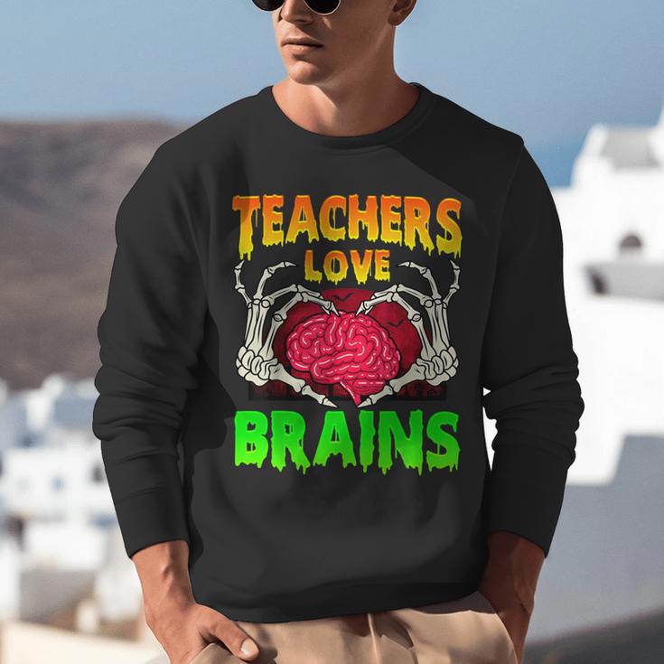 Teacher Teachers Love Brains Skeleton Hand Heart Halloween Unisex Sweatshirt, funny gift Teacher Teachers Love Brains Skeleton Hand Heart Halloween Unisex Sweatshirt, funny gift
