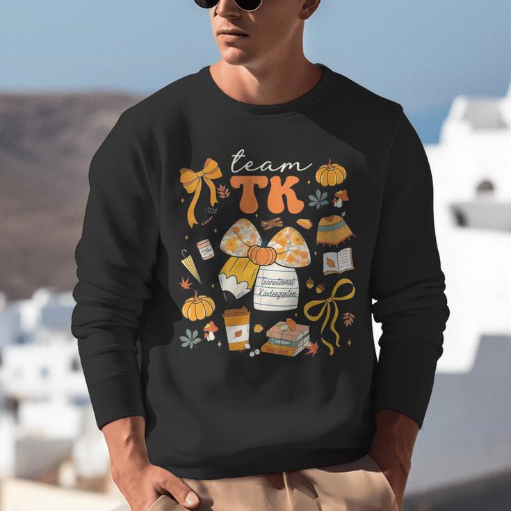 Team TK Crew Preppy Coquette Bow Pumpkin Fall TK Teacher Unisex Sweatshirt, funny gift Team TK Crew Preppy Coquette Bow Pumpkin Fall TK Teacher Unisex Sweatshirt, funny gift