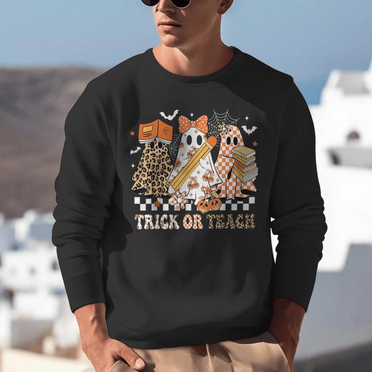 Trick Or Teach Groovy Teacher Halloween Floral Ghost Unisex Sweatshirt, Groovy Teacher Sweatshirts, funny gift