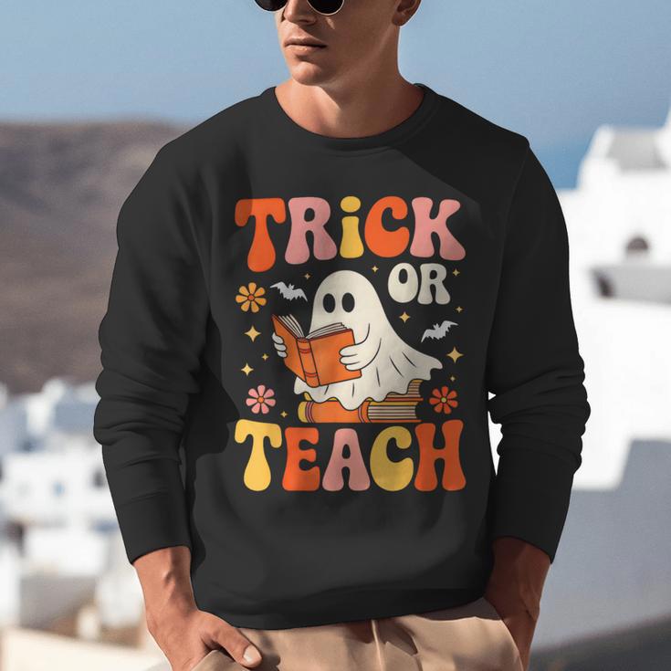 Trick Or Teach Halloween Shirt For Teacher Kids Floral Ghost Unisex Sweatshirt, funny gift Trick Or Teach Halloween Shirt For Teacher Kids Floral Ghost Unisex Sweatshirt, funny gift