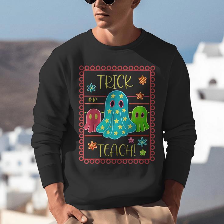 Trick Or Teach Neon Ghost Flower Teacher Spooky Halloween Unisex Sweatshirt, funny gift Trick Or Teach Neon Ghost Flower Teacher Spooky Halloween Unisex Sweatshirt, funny gift