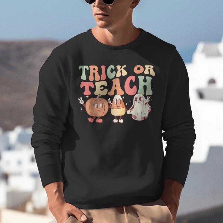 Trick Or Teach Pumpkin Candy Corn Ghost Halloween Teacher Unisex Sweatshirt, funny gift