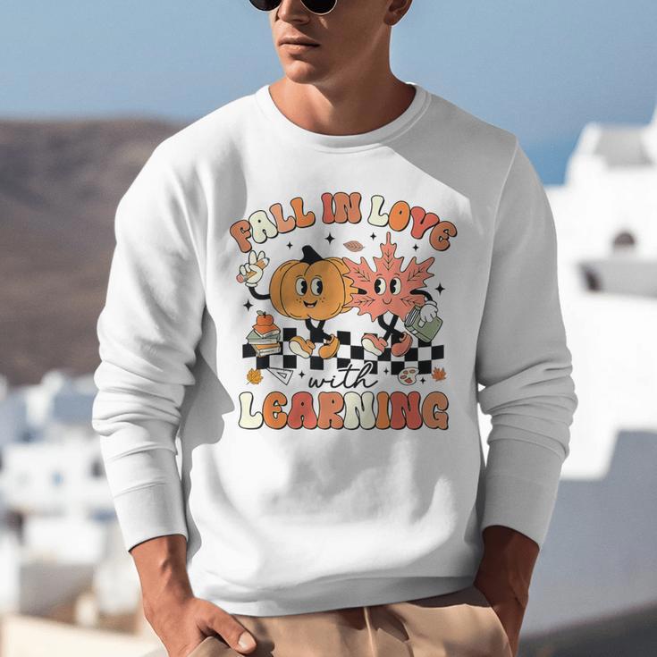 Fall In Love With Learning Teacher Retro Thanksgiving Unisex Sweatshirt, funny gift Fall In Love With Learning Teacher Retro Thanksgiving Unisex Sweatshirt, funny gift
