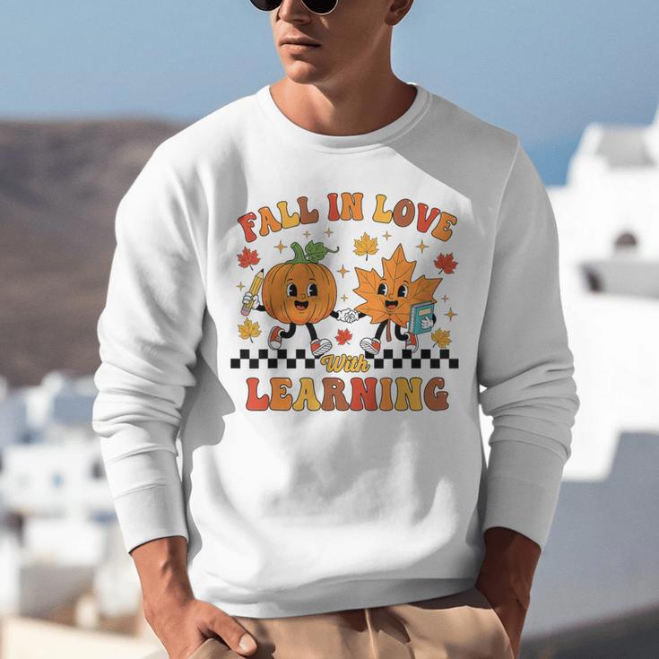 Fall In Love With Learning Teacher Student Autumn Pumpkin Unisex Sweatshirt, funny gift Fall In Love With Learning Teacher Student Autumn Pumpkin Unisex Sweatshirt, funny gift