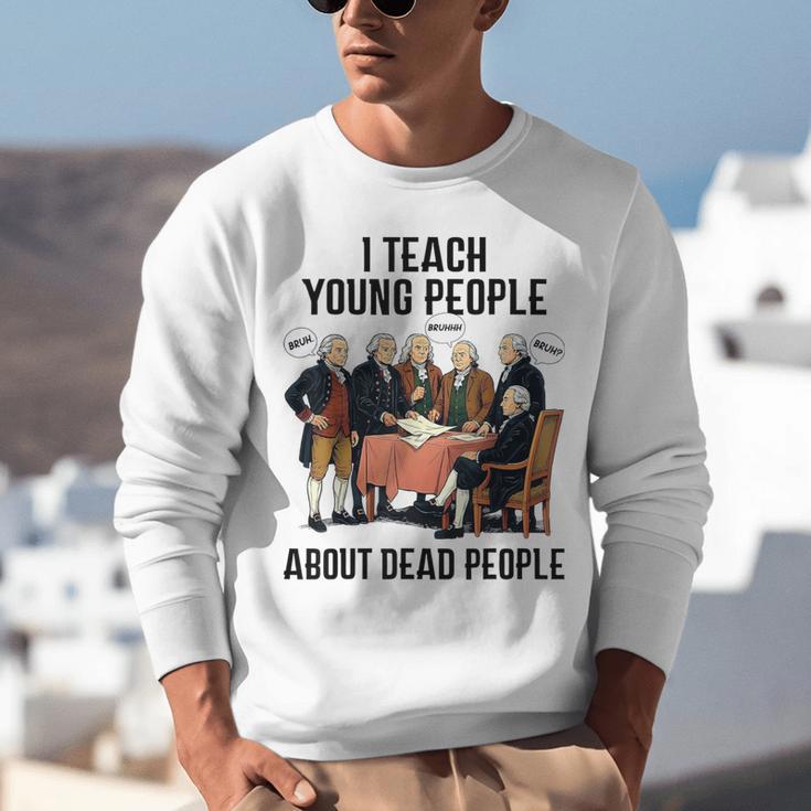 I Teach Young People About Dead-People History Teachers Unisex Sweatshirt, History Teacher Sweatshirts, funny gift I Teach Young People About Dead-People History Teachers Unisex Sweatshirt, History Teacher Sweatshirts, funny gift