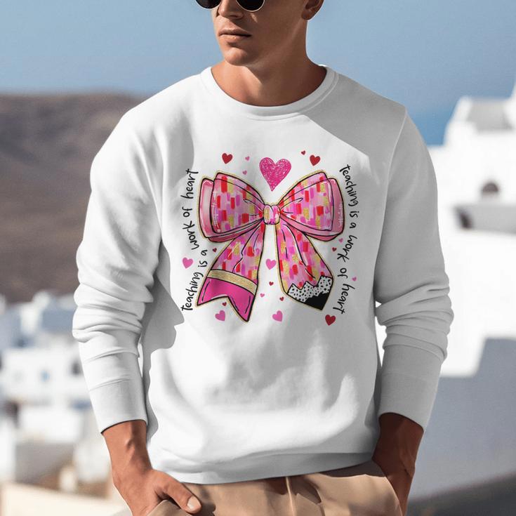 Teaching Is A Work Of Heart Pencil Bow Teacher Valentine Unisex Sweatshirt, funny gift Teaching Is A Work Of Heart Pencil Bow Teacher Valentine Unisex Sweatshirt, funny gift